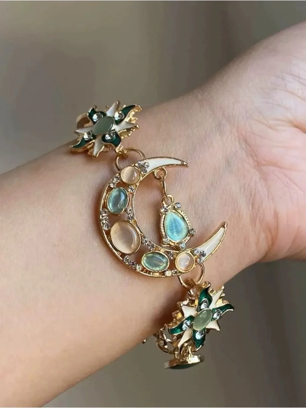 Anthropologie Gold Crescent Moon Bracelet with Green and Pale Blue Stones